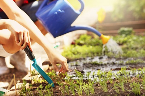 Gardener team at work in a Regent's Park garden preparing tools